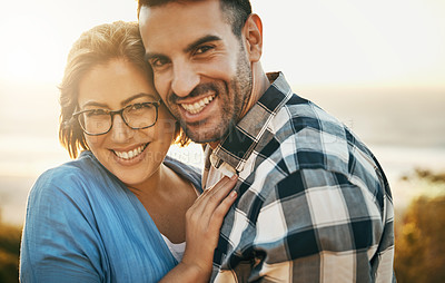 Buy stock photo Cropped shot of a loving couple  spending the day on the beach