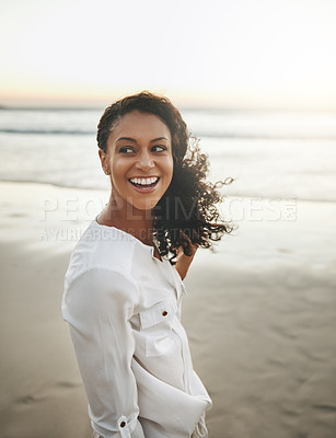 Buy stock photo Cropped shot of a young woman enjoying herself at the beach