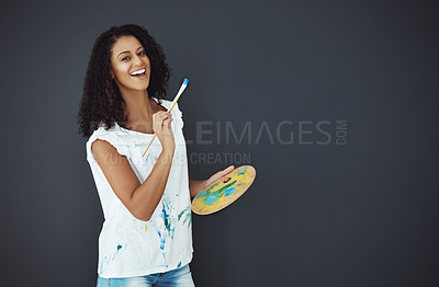 Buy stock photo Portrait of an attractive young female painter in the studio