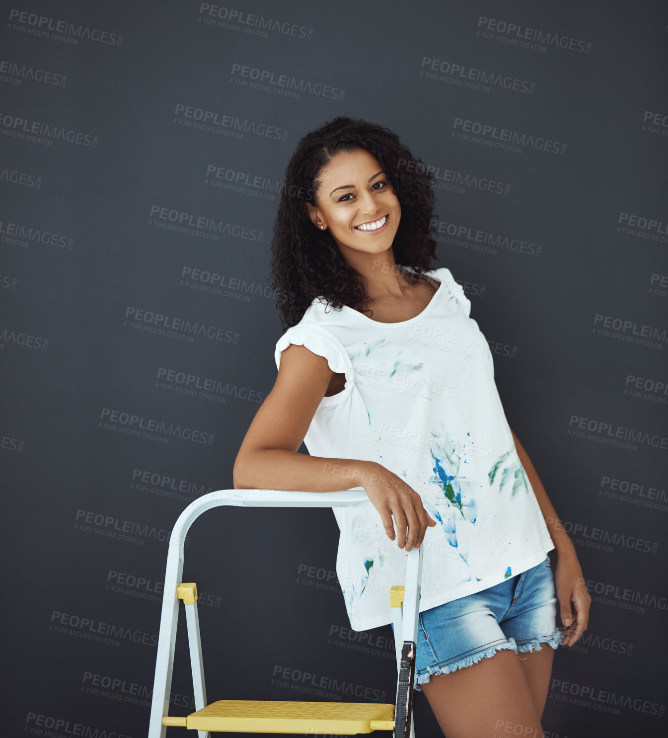 Buy stock photo Portrait of an attractive young female painter in the studio