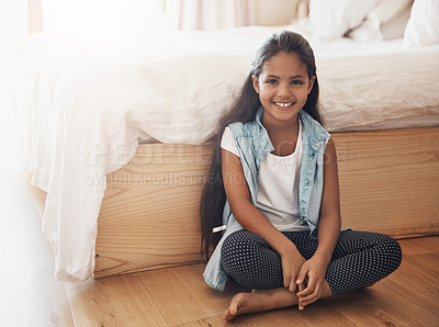 Buy stock photo Portrait of a happy young girl sitting on the floor of her bedroom at home