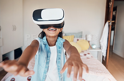 Buy stock photo Shot of a young girl using a virtual reality headset at home