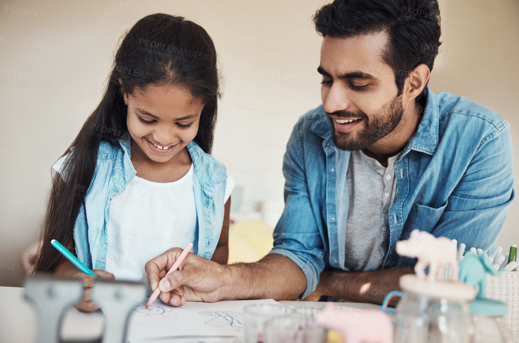 Buy stock photo Shot of a cute young girl and her father drawing on paper together at home