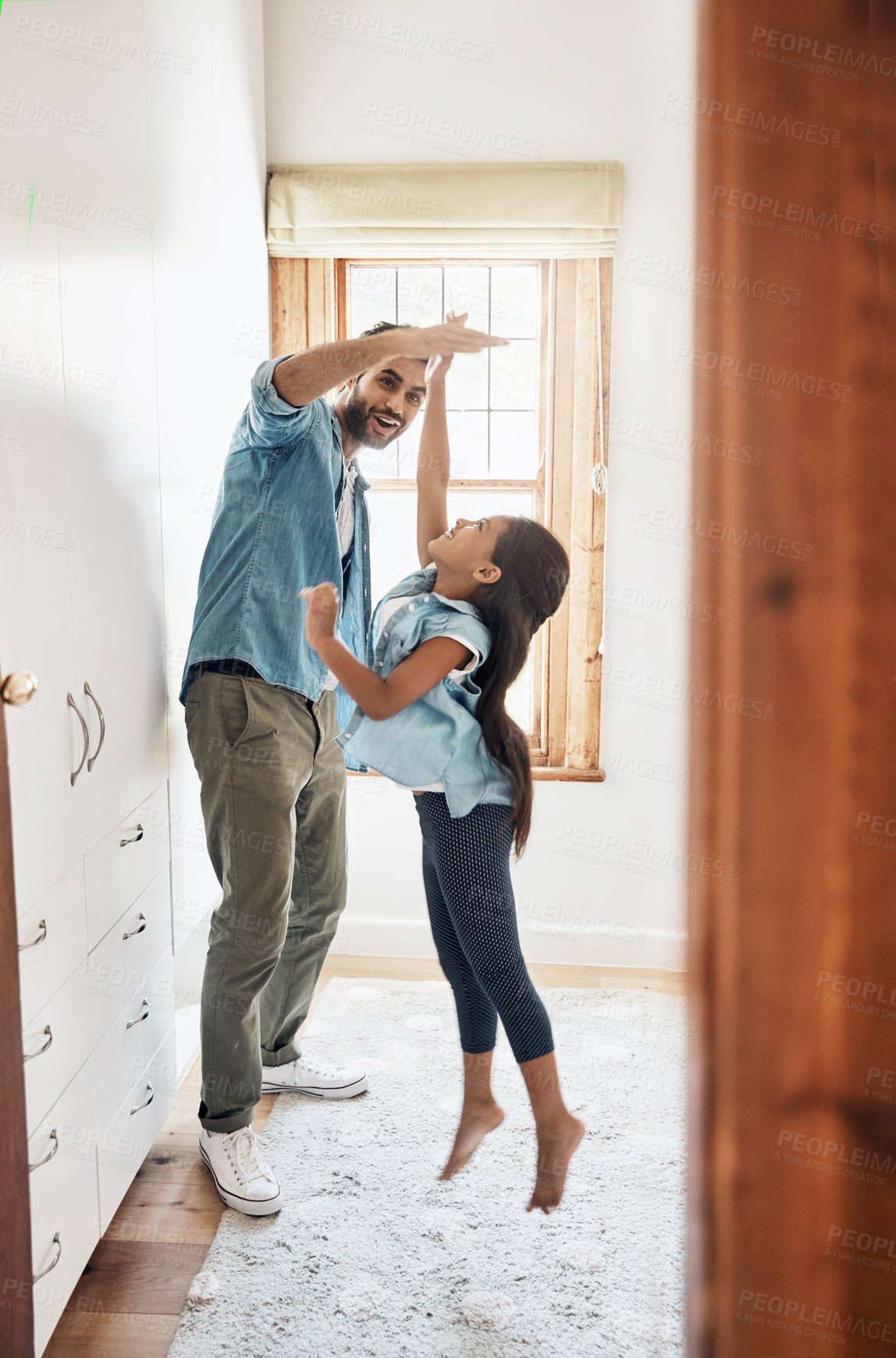 Buy stock photo Energy, high five or jump with father and daughter in bedroom of home together for development or growth. Fun, love or smile with excited girl child and happy man single parent in home for bonding