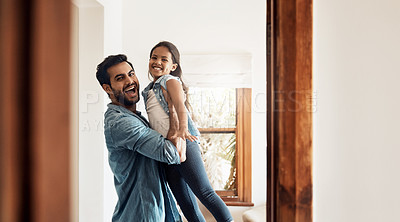 Buy stock photo Shot of a happy father and daughter playing together at home