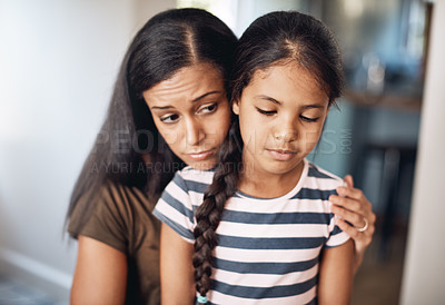 Buy stock photo Shot of a mother comforting her daughter at home