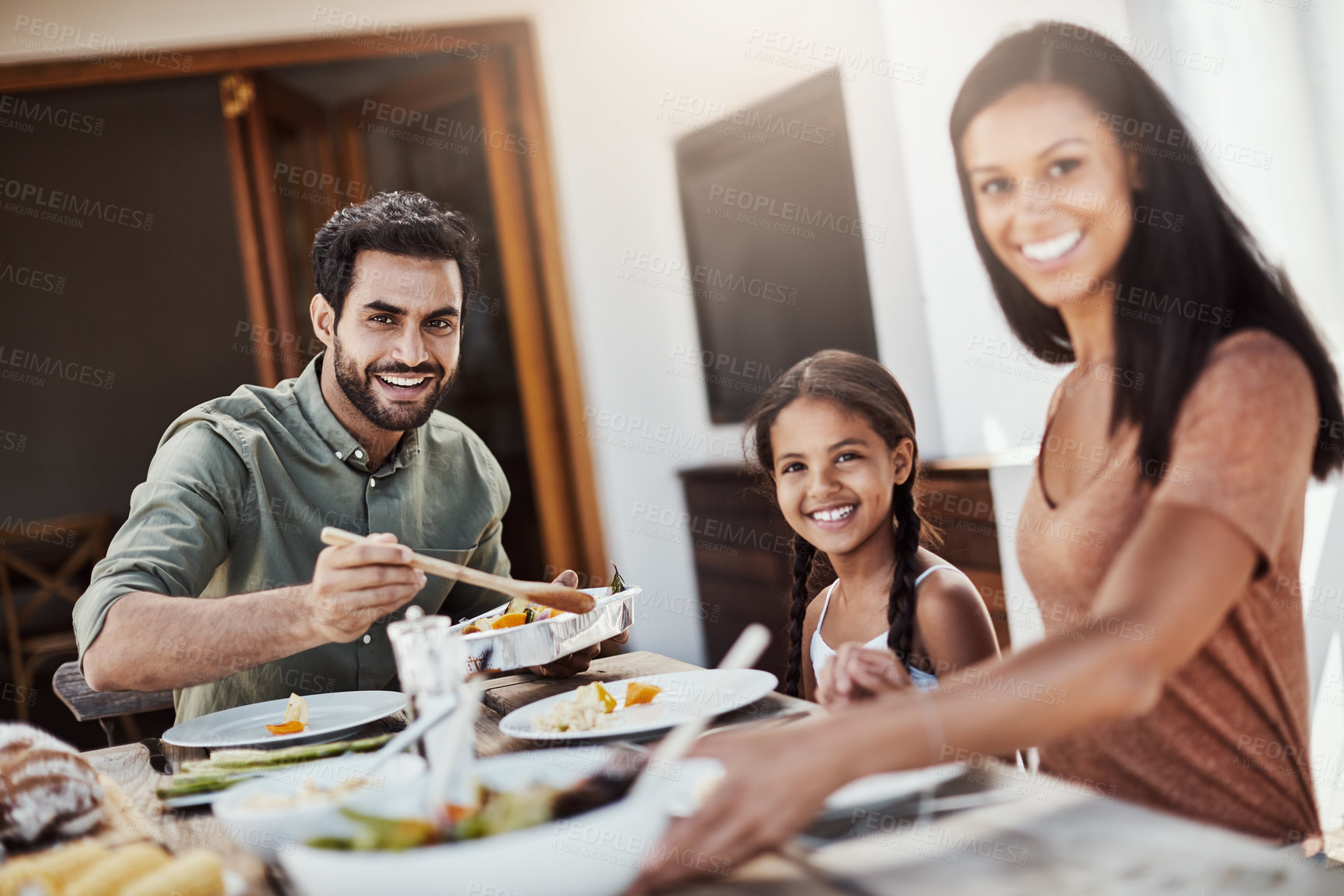 Buy stock photo Parents, kid and portrait in home for dinner with food in dining table or room and bonding. Family, people and smile for support with care or trust and gather to relax, chill and happiness with meal