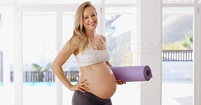 Buy stock photo Cropped portrait of an attractive young pregnant woman carrying a yoga mat