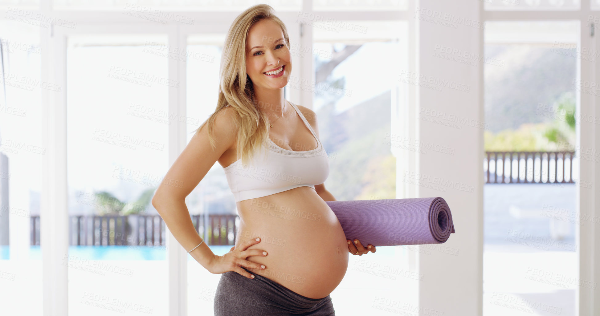 Buy stock photo Cropped portrait of an attractive young pregnant woman carrying a yoga mat