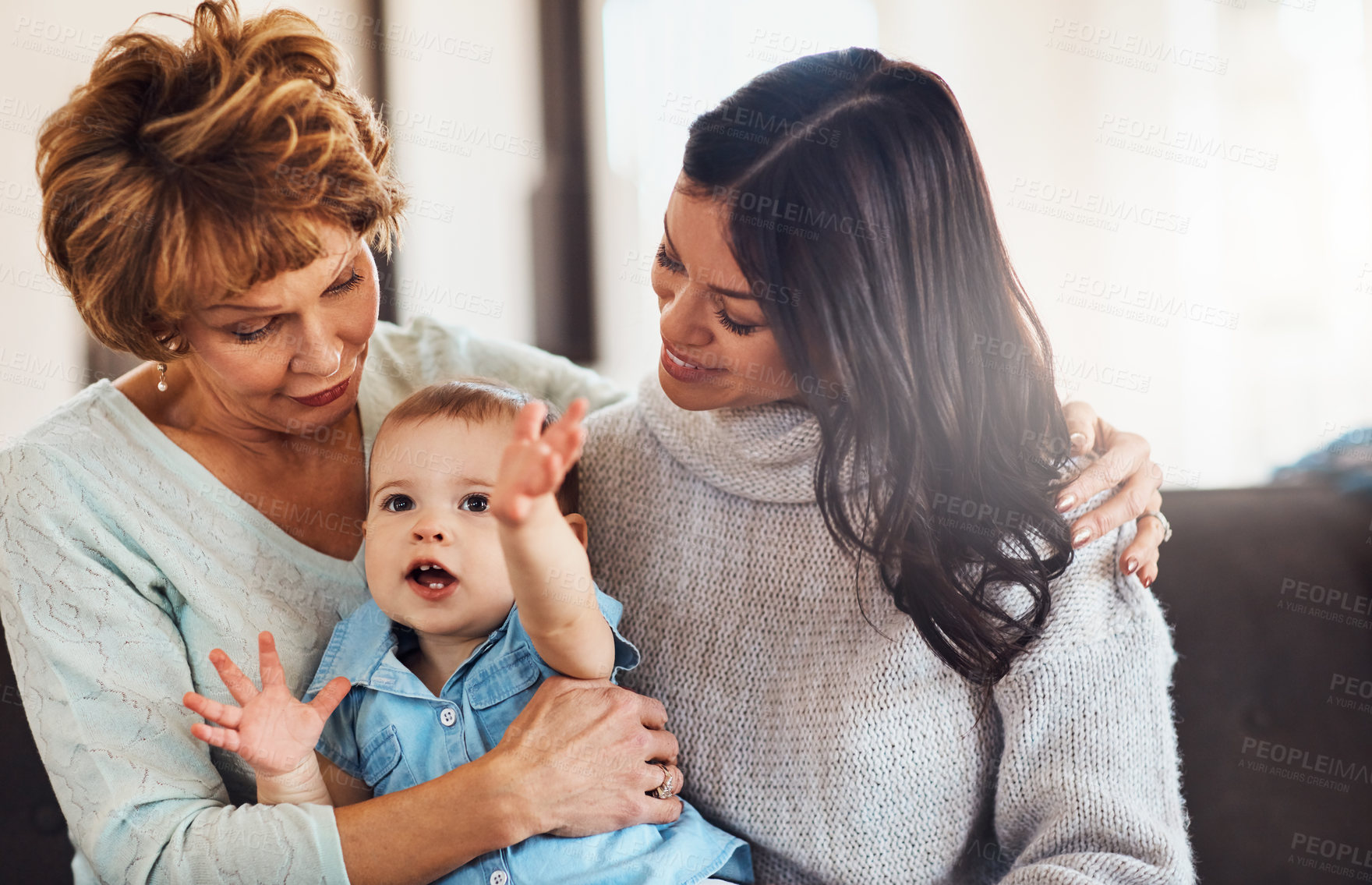 Buy stock photo Mother, baby and grandmother hug on sofa with love, care or bonding with safety, security and conversation at home. Family, generations and kid with mom, grandma and games chilling in living room