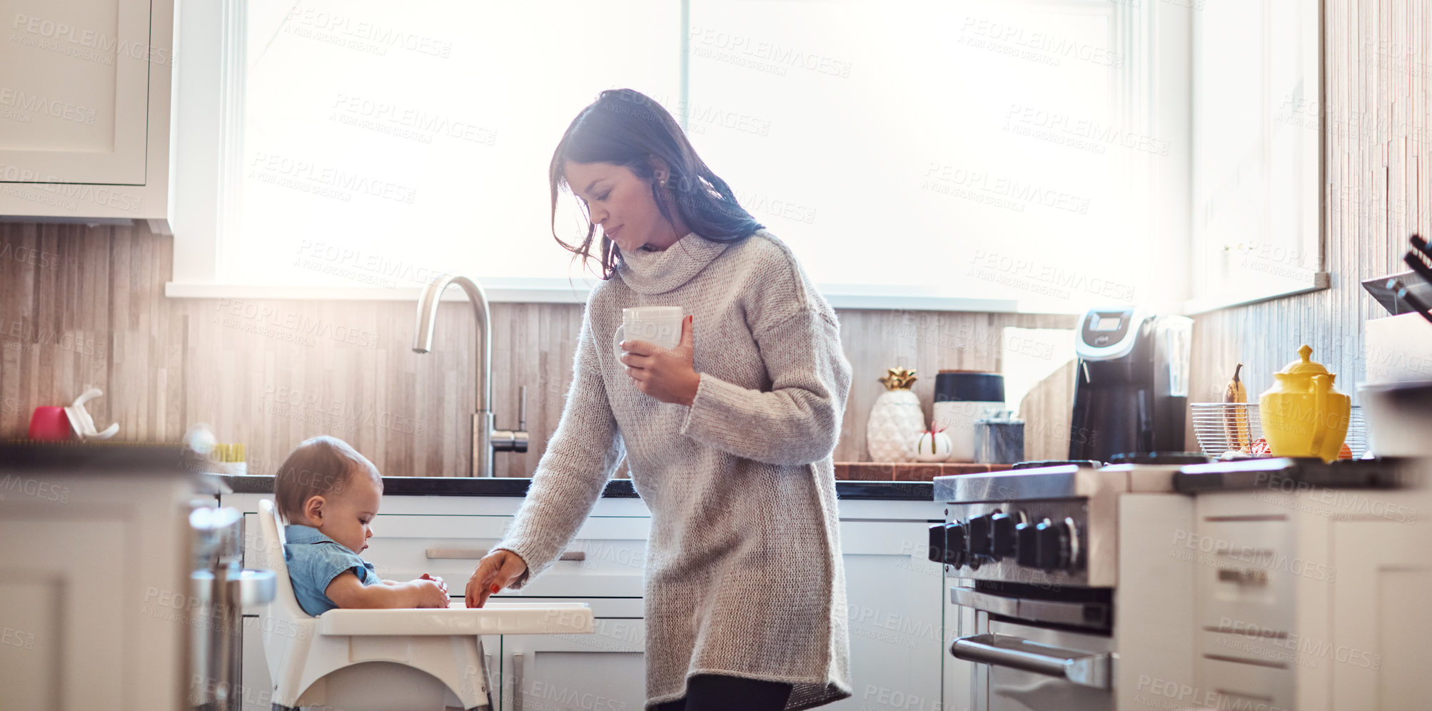 Buy stock photo Kitchen, mom and baby in high chair on day off in home with playing, fun and joy. Parent, woman and toddler for child development or growth with care, support and trust or bonding and family