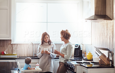 Buy stock photo Grandmother, mom and child in kitchen for love, support and coffee in family home. Women, talking and together in house for childcare, security and protection with toddler for visit or bonding