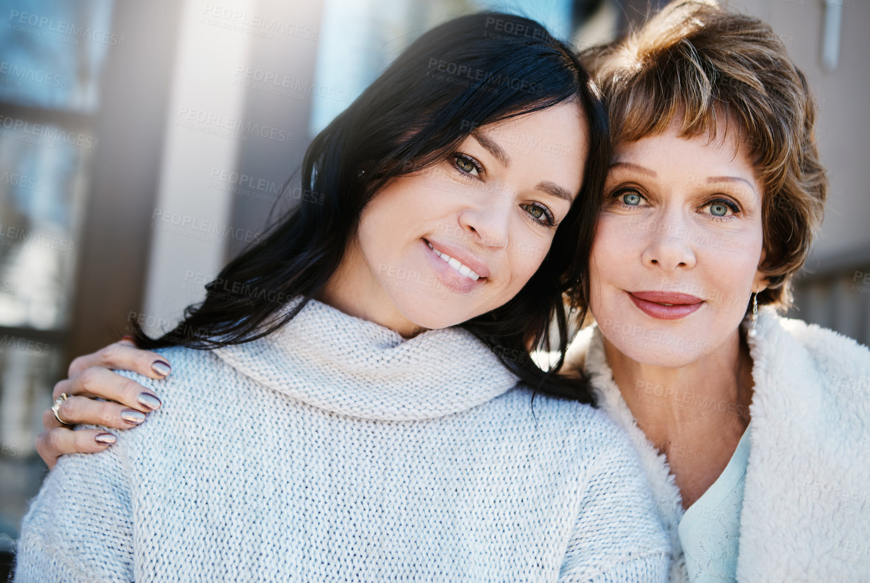 Buy stock photo Shot of a happy young woman spending quality time with her mother