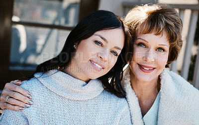 Buy stock photo Shot of a happy young woman spending quality time with her mother