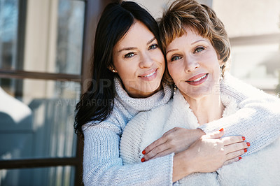 Buy stock photo Shot of a happy young woman spending quality time with her mother