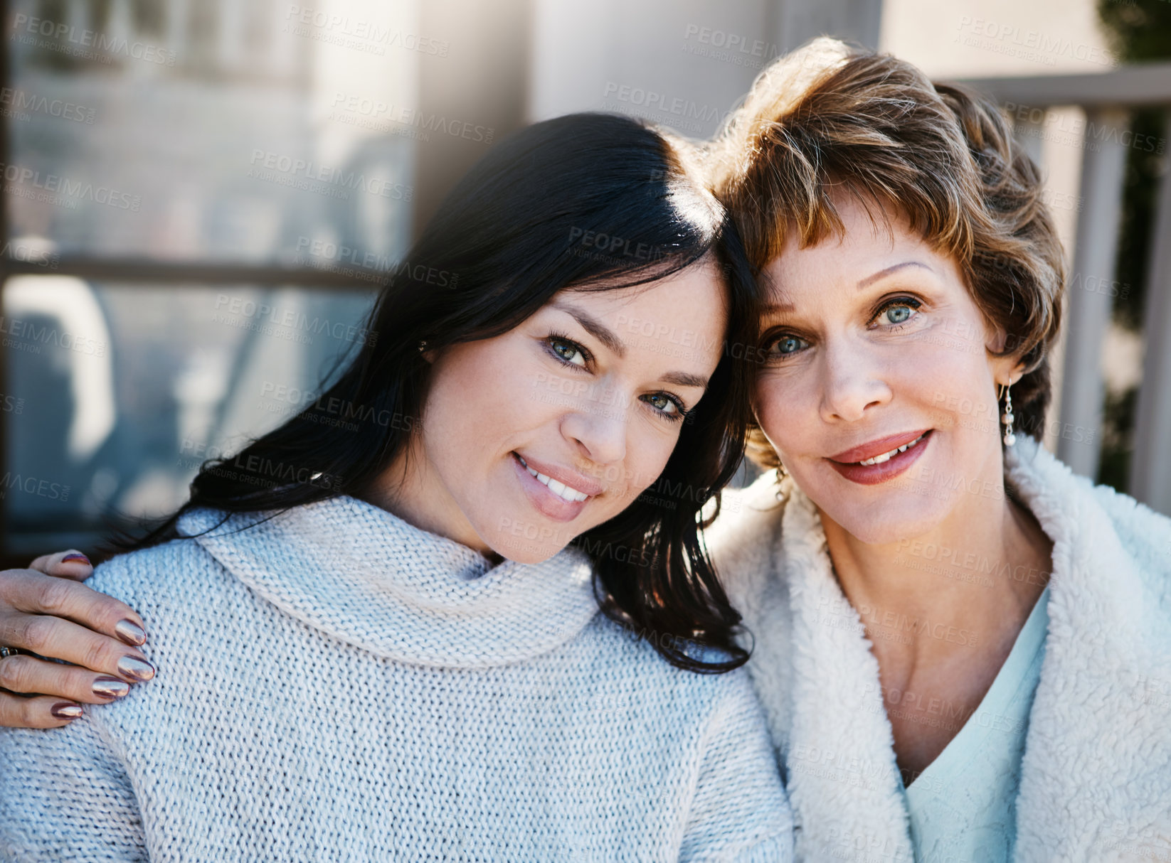 Buy stock photo Shot of a happy young woman spending quality time with her mother