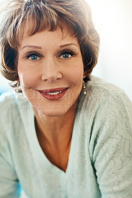 Buy stock photo Portrait of a happy mature woman feeling relaxed at home