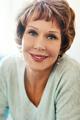 Buy stock photo Portrait of a happy mature woman feeling relaxed at home