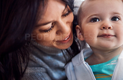 Buy stock photo Shot of an adorable baby girl bonding with her mother at home