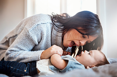 Buy stock photo Love, games and mother with baby on a bed for playing, bonding and morning routine in their home together. Safety, family and woman with kid in a bedroom for learning, teaching or child development