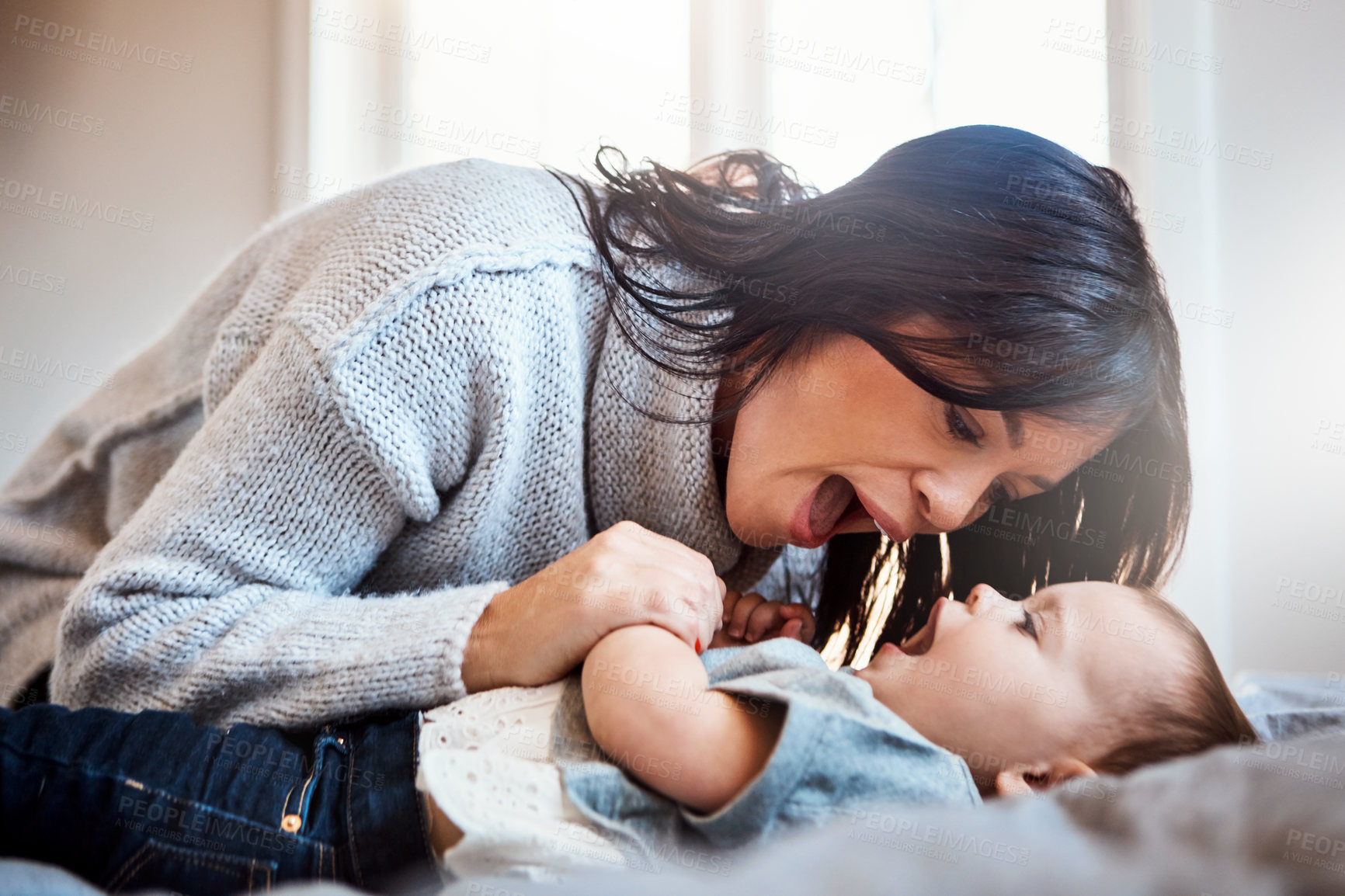 Buy stock photo Love, games and mother with baby on a bed for playing, bonding and morning routine in their home together. Safety, family and woman with kid in a bedroom for learning, teaching or child development