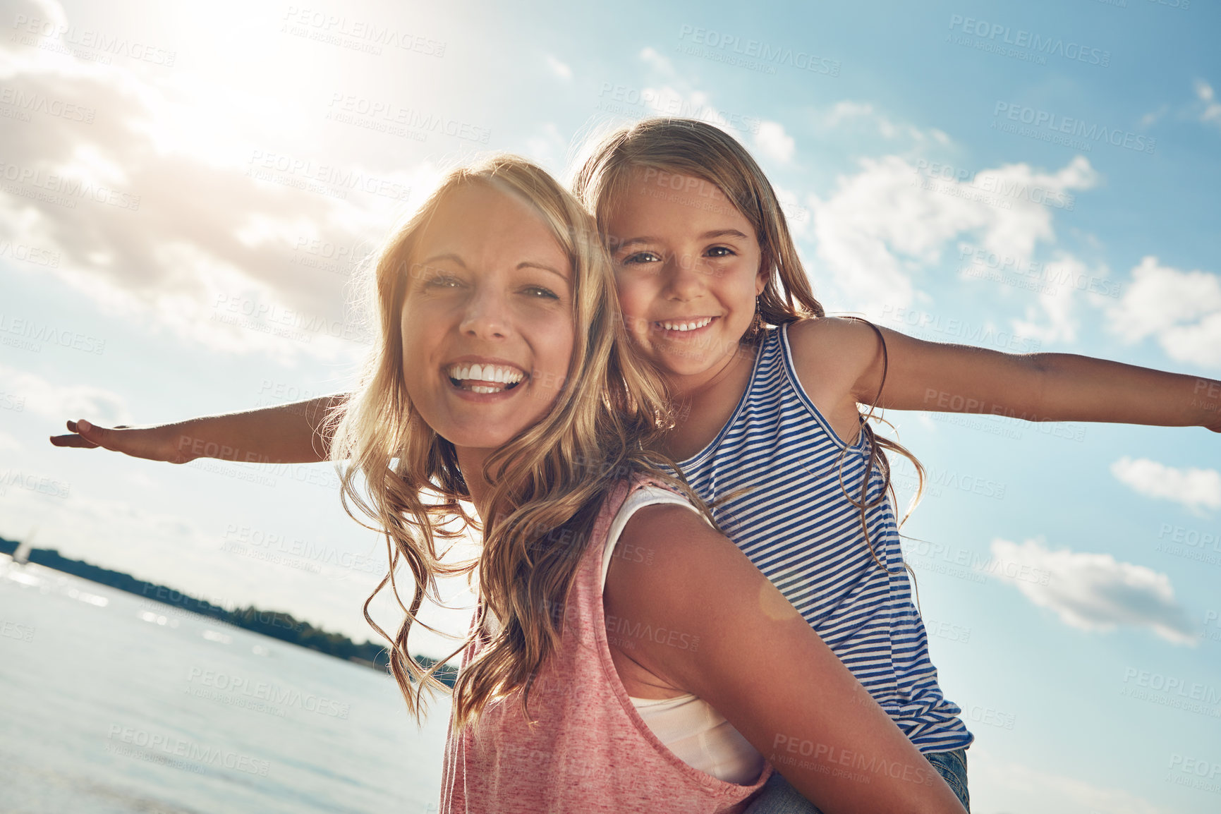 Buy stock photo Portrait, mother and child at ocean with airplane, smile and playing on adventure holiday in Australia. Travel, mom and girl on beach vacation with summer fun, happy and bonding together with games.