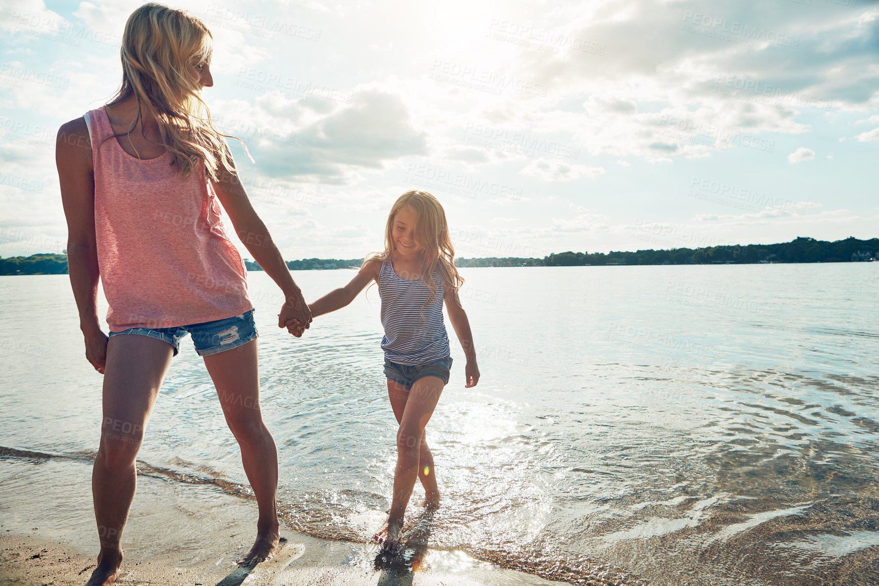 Buy stock photo Walking, mother and child on beach holding hands with smile, water or fun adventure holiday in Australia. Travel, mom and girl on ocean vacation with happy summer, support or outdoor bonding together