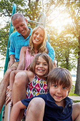 Buy stock photo Family, park slide and portrait of group in summer to relax with parents on playground on vacation. Happy, holiday and children together for party, games or smile outdoor at school recess or break