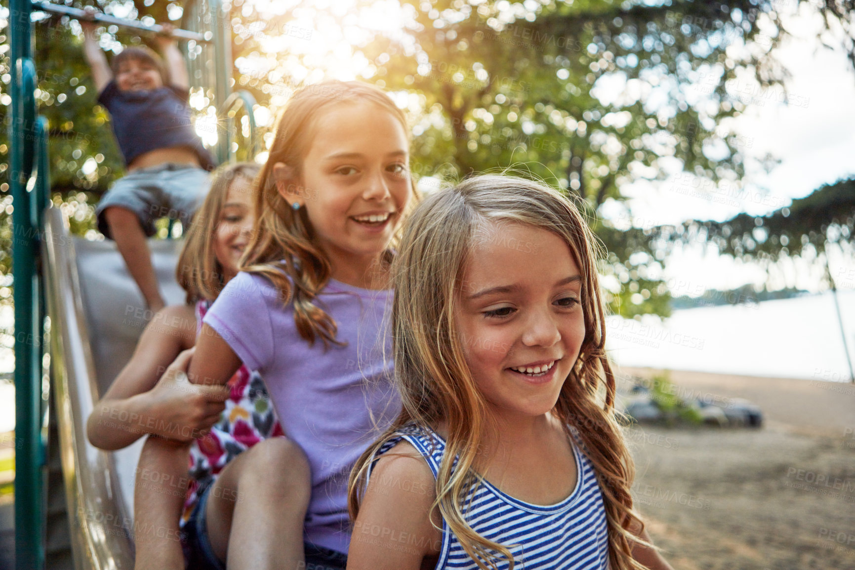 Buy stock photo Kids, park slide and group in summer to relax with friends on sunshine playground on vacation. Happy, holiday and children together for party, games or smile outdoor at school recess or break