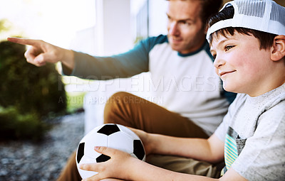 Buy stock photo Shot of a father and his son bonding on their porch at home