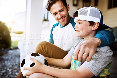 Buy stock photo Shot of a father and his son bonding on their porch at home