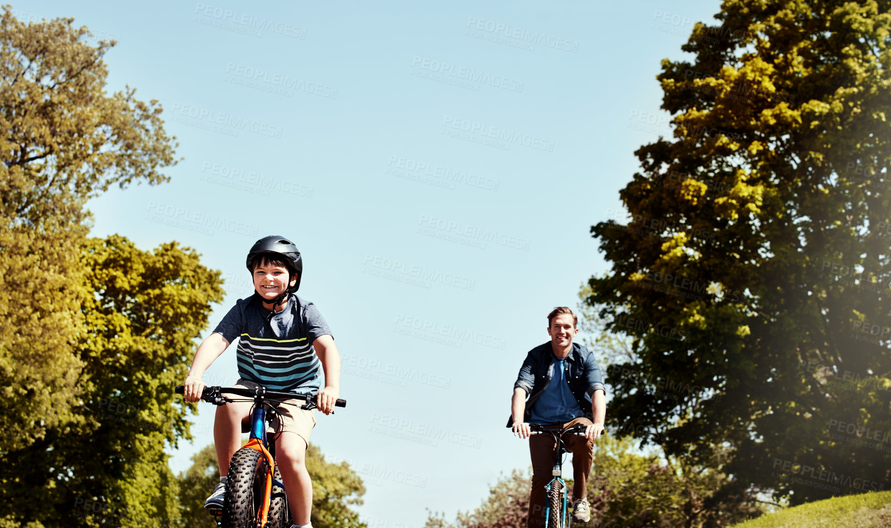 Buy stock photo Happy dad, kid and riding with bicycle for bonding, fun childhood or physical activity together. Father, child or cycling with son or smile for travel, learning or health and wellness in neighborhood