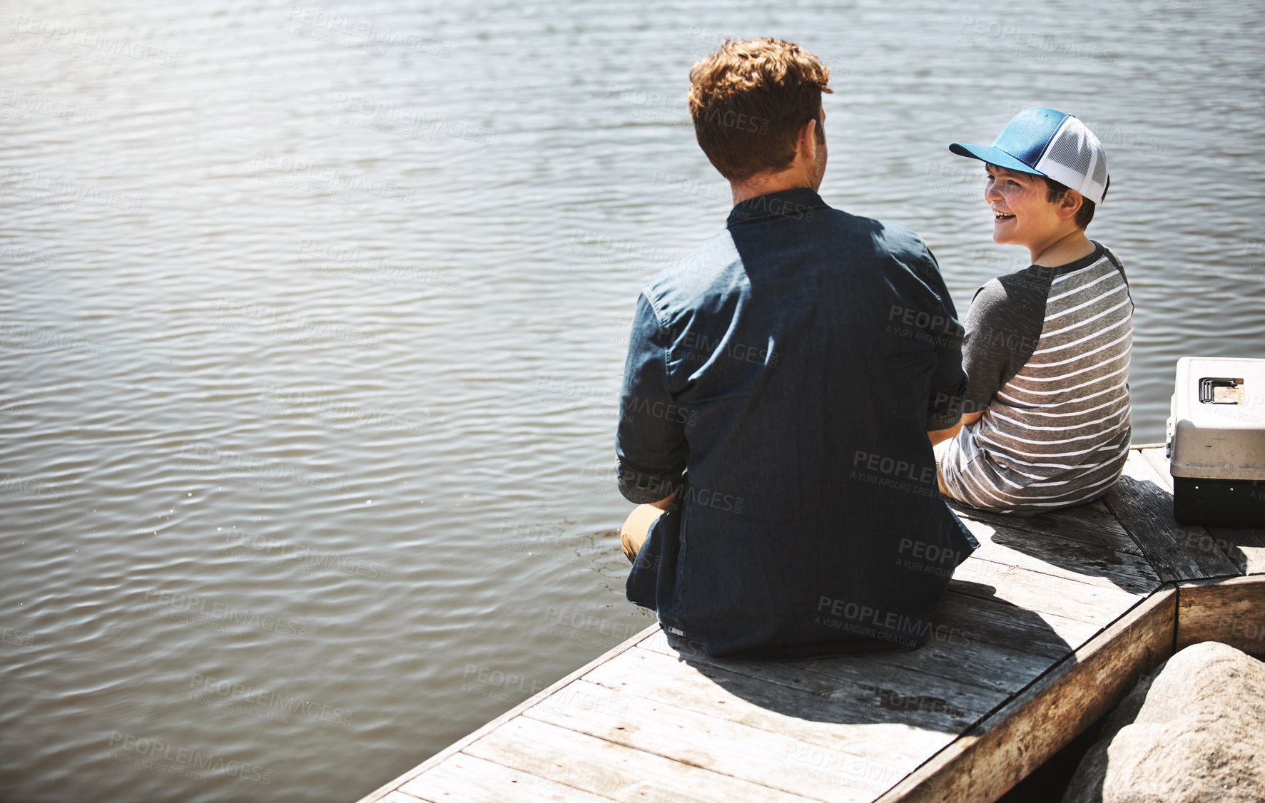 Buy stock photo Fishing, lake and happy father with child in nature for teaching skill, adventure and vacation together outdoors. Family, fun and dad with young boy by river with rod for sports, hobby and catch fish