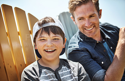 Buy stock photo Portrait of a little boy bonding with his father outdoors