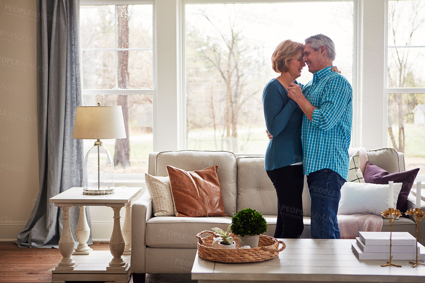 Buy stock photo Holding hands, dance and calm senior couple in house with music, bonding or peace at home together. Radio, marriage or old people moving to audio, streaming or safety and security in living room