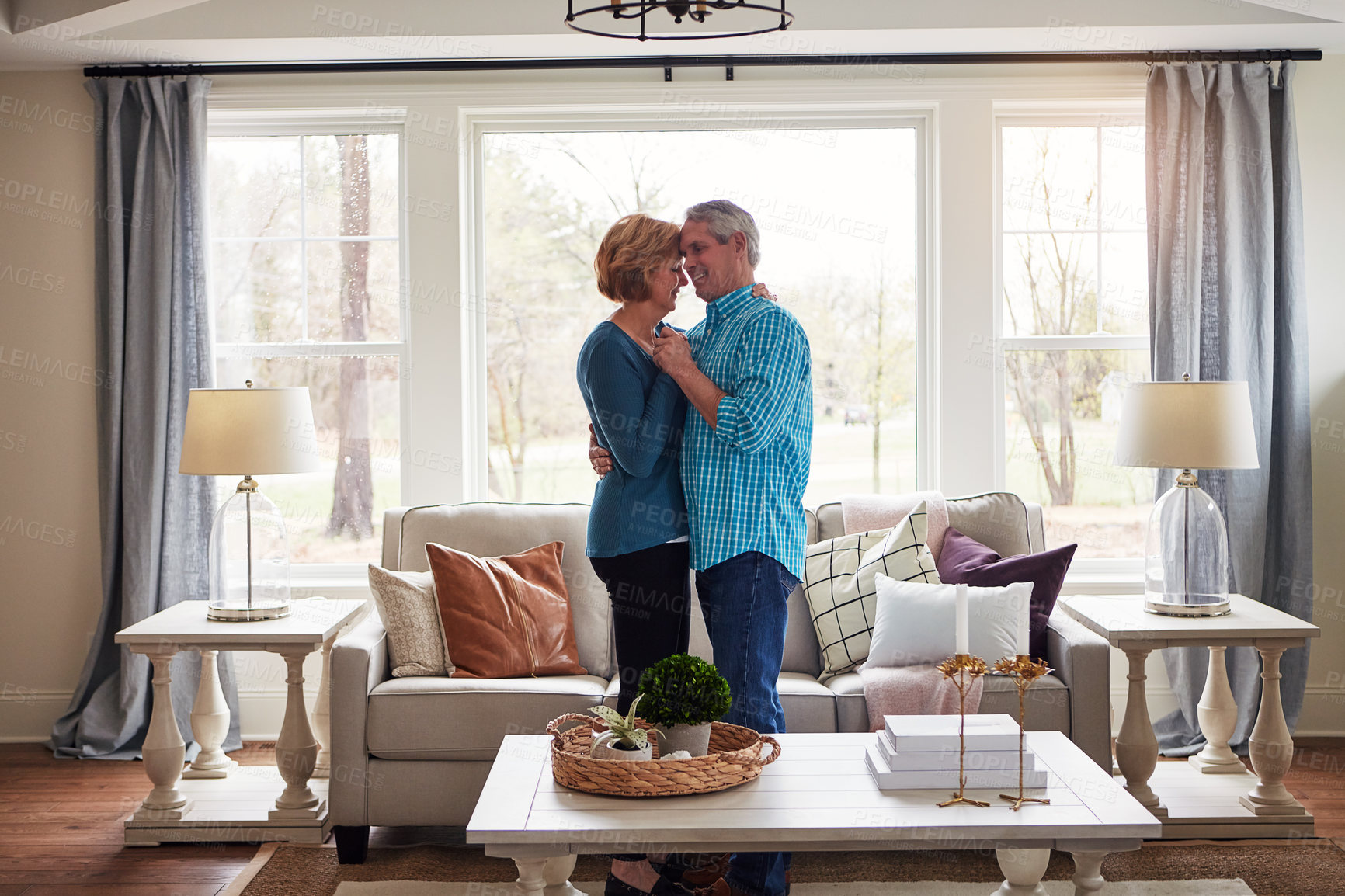 Buy stock photo Holding hands, dance and happy senior couple in house with music, bonding or fun at home together. Radio, marriage or old people moving to audio, streaming or retirement celebration in living room