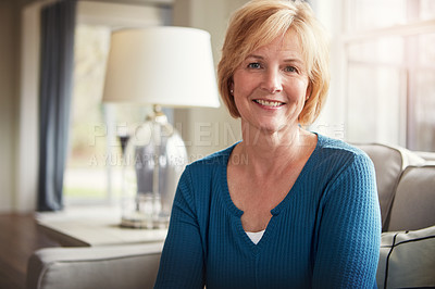 Buy stock photo Happy, relax and portrait of mature woman on a sofa with confidence, peace and positive attitude in her home. Face, smile or female person calm in living room with peaceful, morning or break in house