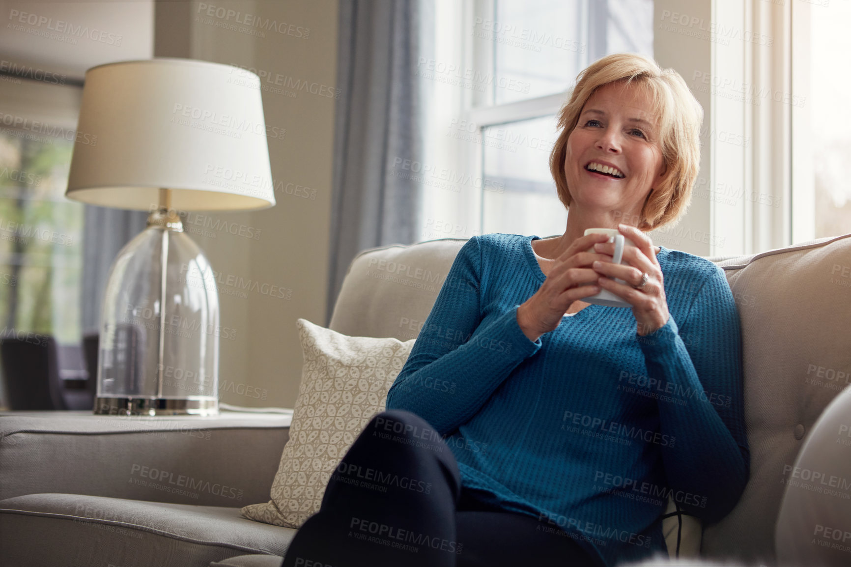 Buy stock photo Happy, thinking and senior woman on sofa with coffee, relax and nostalgic morning reflection at home. Remember, calm and elderly female person with tea break in living room for peace, memory or pride