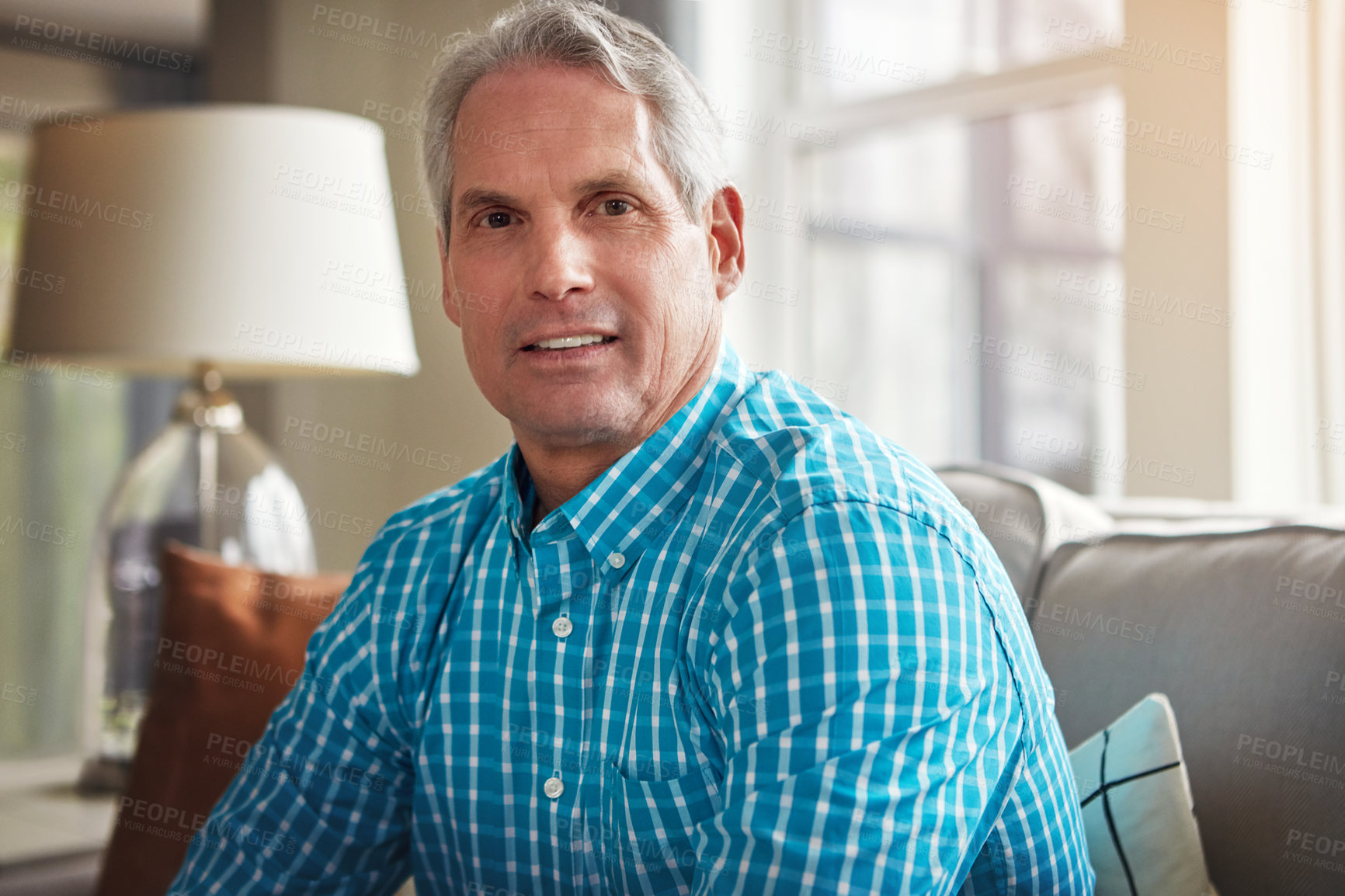 Buy stock photo Portrait, senior man and relax on sofa for weekend break, peaceful retirement and wellness. Pensioner, old person and smile in living room for calm morning, positive attitude and comfortable in home