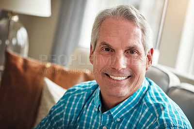 Buy stock photo Portrait of a happy mature man relaxing on the sofa at home