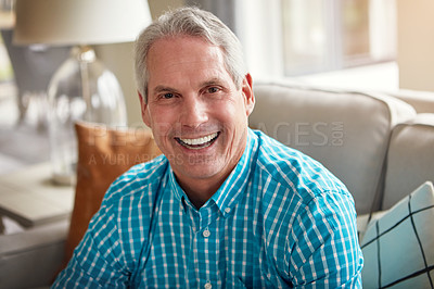 Buy stock photo Portrait of a happy mature man relaxing on the sofa at home