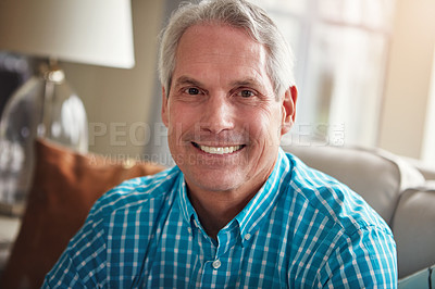 Buy stock photo Portrait of a happy mature man relaxing on the sofa at home