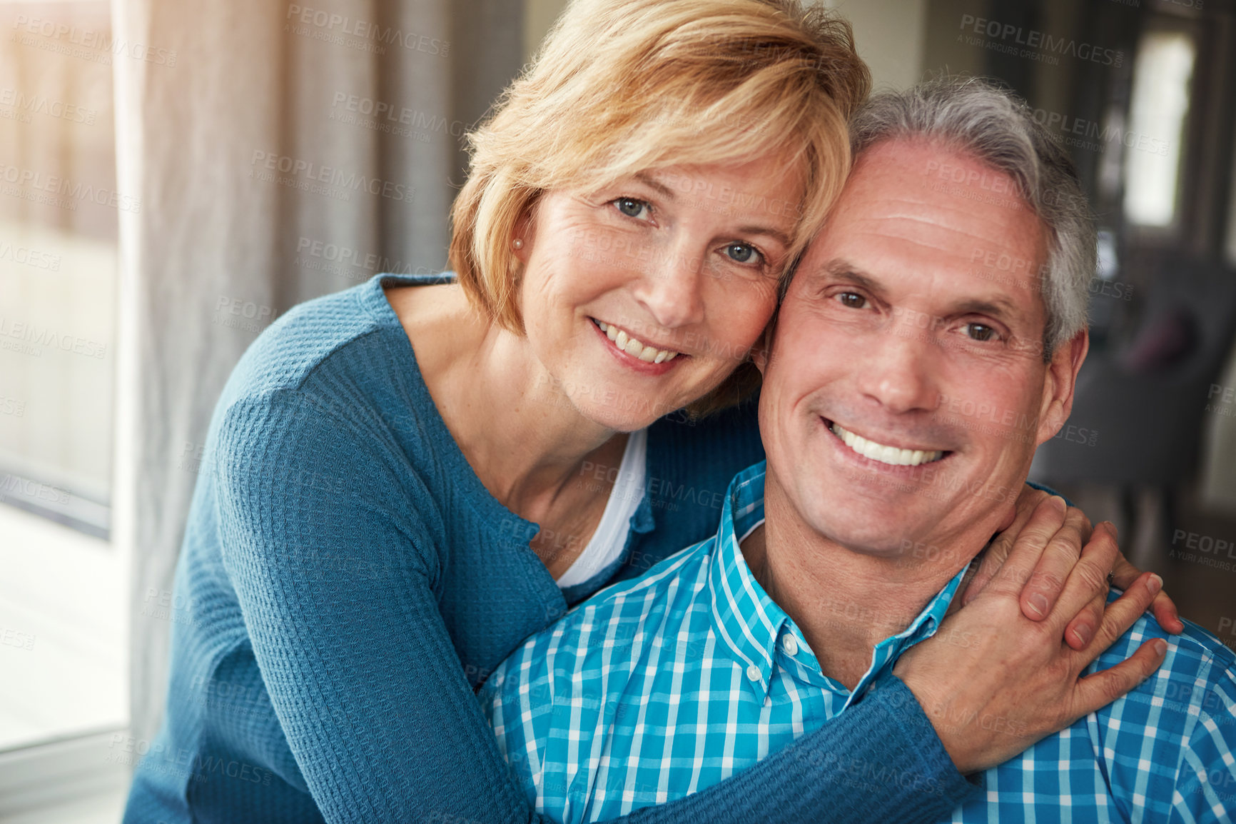 Buy stock photo Portrait, happy and mature couple hug for bonding, loving relationship and relax together in home. Marriage, love and man and woman embrace for affection, commitment and romance in living room
