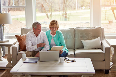 Buy stock photo Senior couple, paperwork and reading on couch with laptop, smile or point for taxes in home. Old man, woman and computer with documents for compliance, audit or investment report for financial review