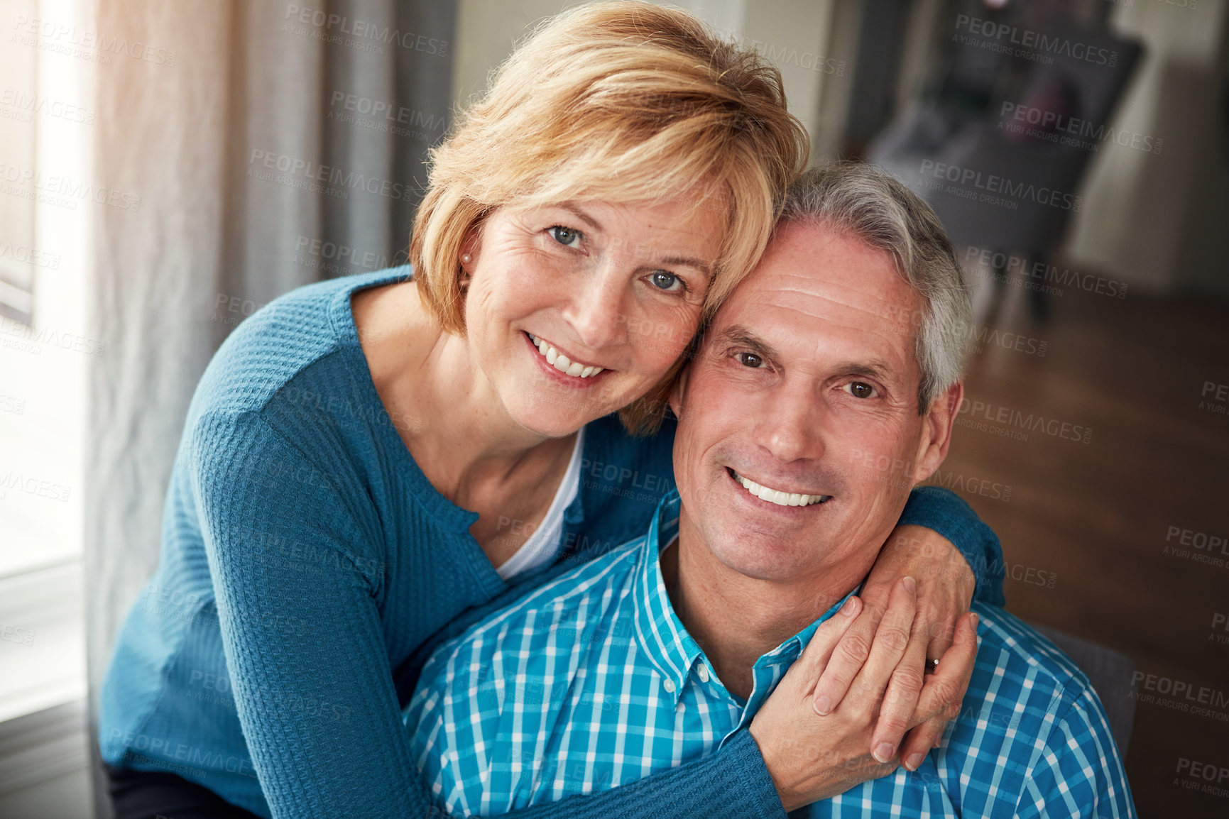 Buy stock photo Smile, home and portrait of mature couple for bonding, loving relationship and relax together. Marriage, love and happy man and woman embrace for affection, commitment and romance in living room