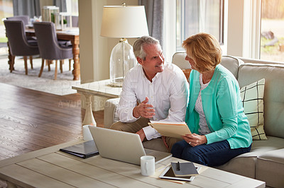 Buy stock photo Senior couple, paperwork and finance on couch with laptop, smile or check for taxes in home. Old man, woman and computer with documents for compliance, audit or investment report for budget review