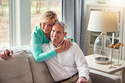 Buy stock photo Shot of a mature couple relaxing together at home