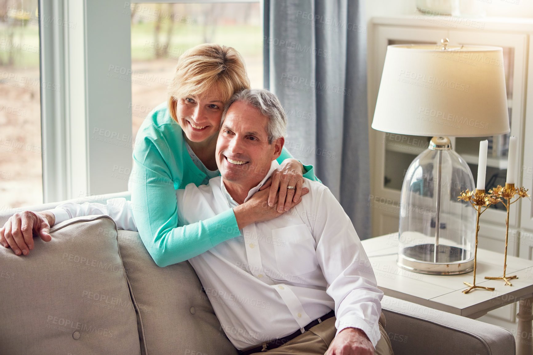 Buy stock photo Shot of a mature couple relaxing together at home