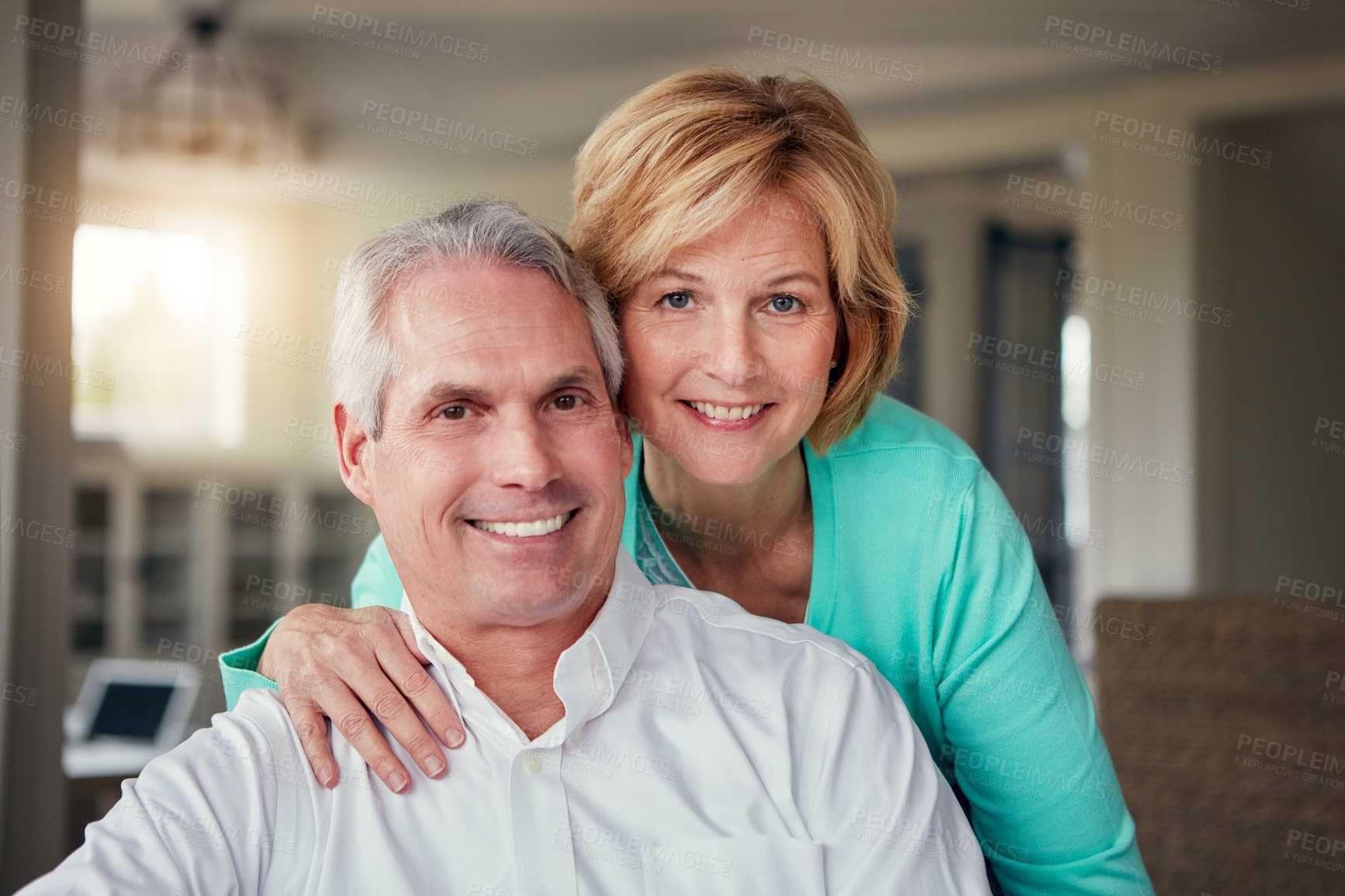 Buy stock photo Portrait of a mature couple relaxing together at home