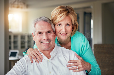 Buy stock photo Portrait of a mature couple relaxing together at home